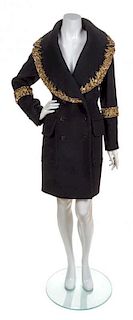 * An Alexander McQueen Black Flannel Coat, Size 42.