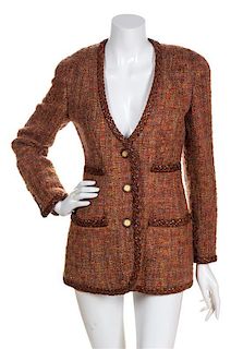 * A Chanel Rust Boucle Jacket, Size 38.