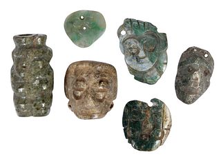 Six Mesoamerican Carved Jade Mask and Figural Pendants