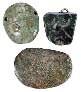Three Mesoamerican Carved Jade Mask Pendants