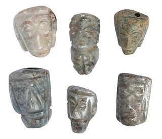 Five Small Mesoamerican Carved Jade Mask Pendants and One Seated Figure
