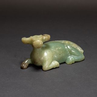 A CHINESE JADE MODEL OF SEATED OX