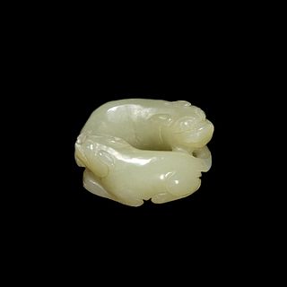 A CHINESE CARVED JADE MYTHICAL BEAST 