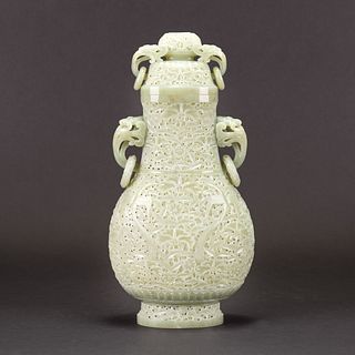 A CARVED CELADON WHITE JADE VASE AND COVER