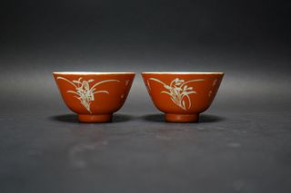 A PAIR OF CHINESE RED GROUND ORCHID CUPS, WITH MARK