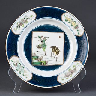 A BLUE AND WHITE PROCELAIN PLATE