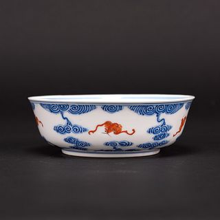 A BLUE AND WHITE AND IRON RED 'BAT' BOWL 