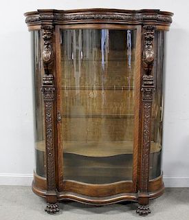 Highly Carved Oak Curved Glass China Cabinet.
