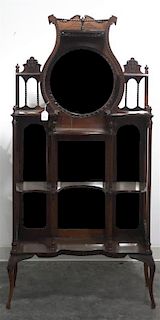 A Victorian Mahogany Etagere, Height 66 x width 32 x depth 12 1/2 inches.