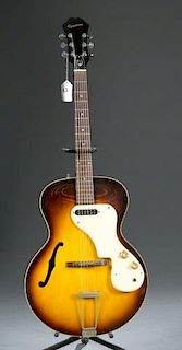 An Epiphone Granada hollow body electric guitar, w