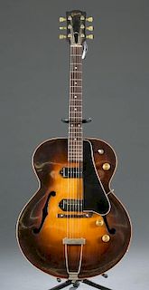 A Gibson ES-150 altered hollow body guitar.