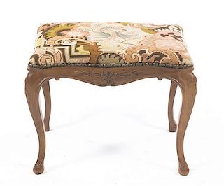 A French Provincial Needlepoint Upholstered Stool, Height 14 3/4 x width 19 1/4 x depth 14 1/2 inches.