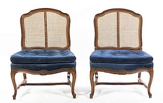A Pair of Louis XV Style Walnut Fauteuils, Height 33 1/2 inches.