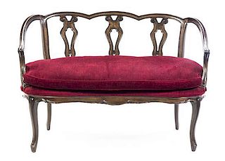 A French Provincial Style Walnut Settee, Width 50 inches.