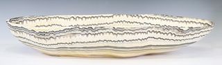 LARGE GEOLOGICAL NATURAL-EDGE ONYX BOWL, 28.5"W