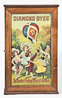 A Diamond Dyes store display cabinet with chromolithograph on tin of children