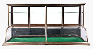 A large early 20th century nickel sheathed cylinder front country store display case
