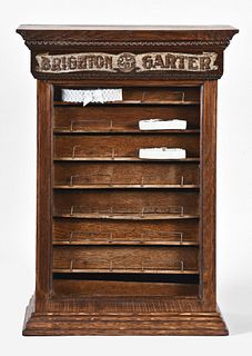 A turn of the 20th century Brighton Garter counter top display cabinet