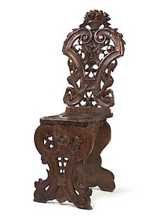 A Renaissance Revival Carved Mahogany Hall Chair, Height 45 inches.