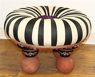 A Mackenzie Childs Upholstered Stool, Height 14 1/2 x diameter 21 inches.