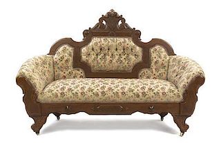 A Victorian Walnut Settee, Width 62 1/2 inches.