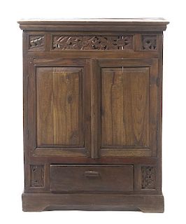 A Southeast Asian Carved Console Cabinet, Height 43 x width 33 1/8 x depth 15 3/4 inches.