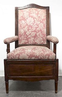 A Provincial Walnut Commode Chair, Height 45 inches.