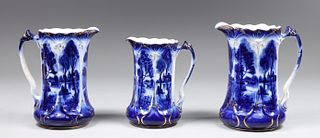 Group of Three Antique Flow Blue Pitchers