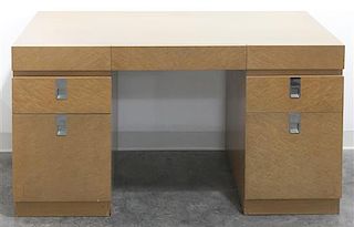 A Modernist Maple Desk, Baker, Height 29 x width 54 x depth 26 inches.