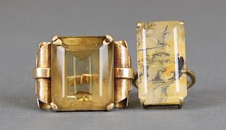 2 gemstone and yellow gold rings.