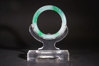 A JADEITE BANGLE WITH CERTIFICATE