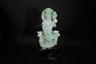 A JADEITE CARVING OF GUANYIN WITH BASE