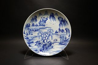 A LARGE CHINESE BLUE AND WHITE PLATE WITH LANDSCAPE FIGURE STORY