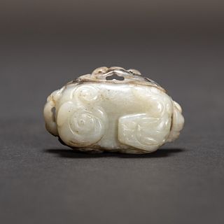 A CARVED JADE DRAGON ORNAMENT 