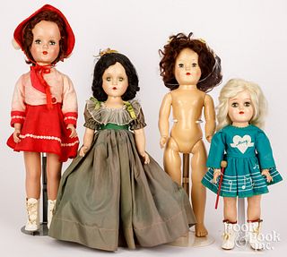 Four hard plastic dolls