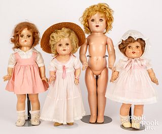 Four composition dolls