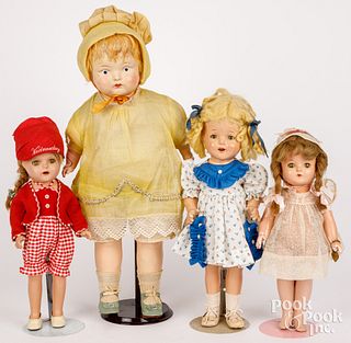 Four composition dolls