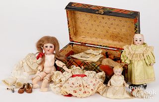 Three small bisque dolls