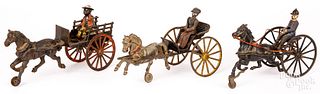 Three cast iron horse drawn carts