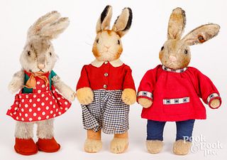 Three Steiff dressed rabbits