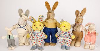 Seven dressed vintage plush rabbits