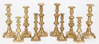 Five pairs of Victorian brass candlesticks