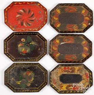 Six small toleware trays, 19th c.
