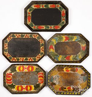 Five toleware trays, 19th c.