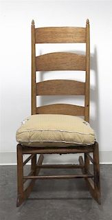 An American Ladder Back Rocking Chair, Height 42 inches.