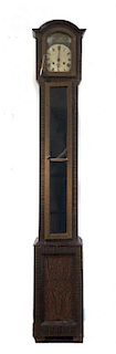 An American Faux Grain Tall Case Clock, Height overall 64 inches.
