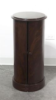 A Regency Style Mahogany Pedestal Cabinet, Height 30 1/4 x diameter 14 3/8 inches.