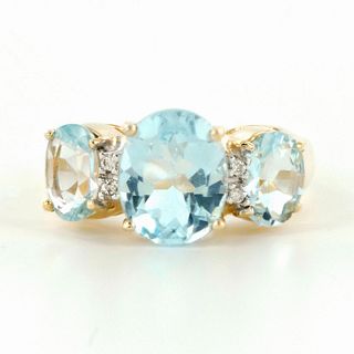 Sparkling 10K Yellow Gold and Light Blue Topaz Ring