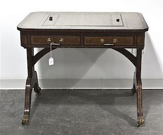 A Regency Style Leather Clad Game Table, Height 28 1/2 x width 37 x depth 26 inches.
