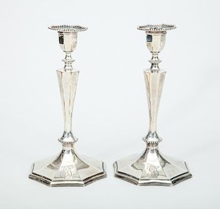Pair of Theodore B. Starr Monogrammed Silver Weighted Candlesticks